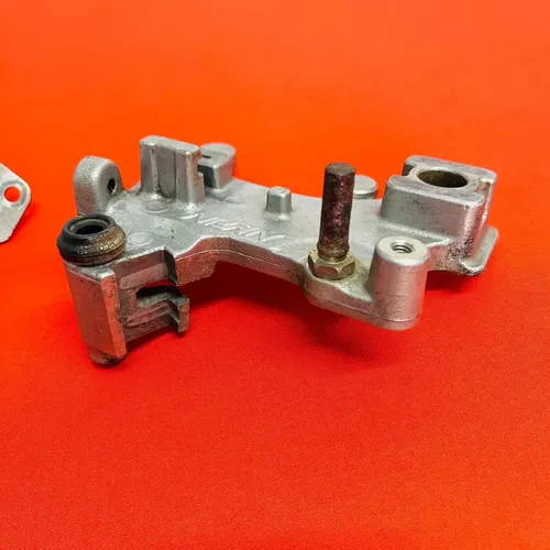 CR85 REAR BRAKE CALIPER MOUNT BRACKET GENUINE OEM HONDA CR 85 R RB (2003-2008)