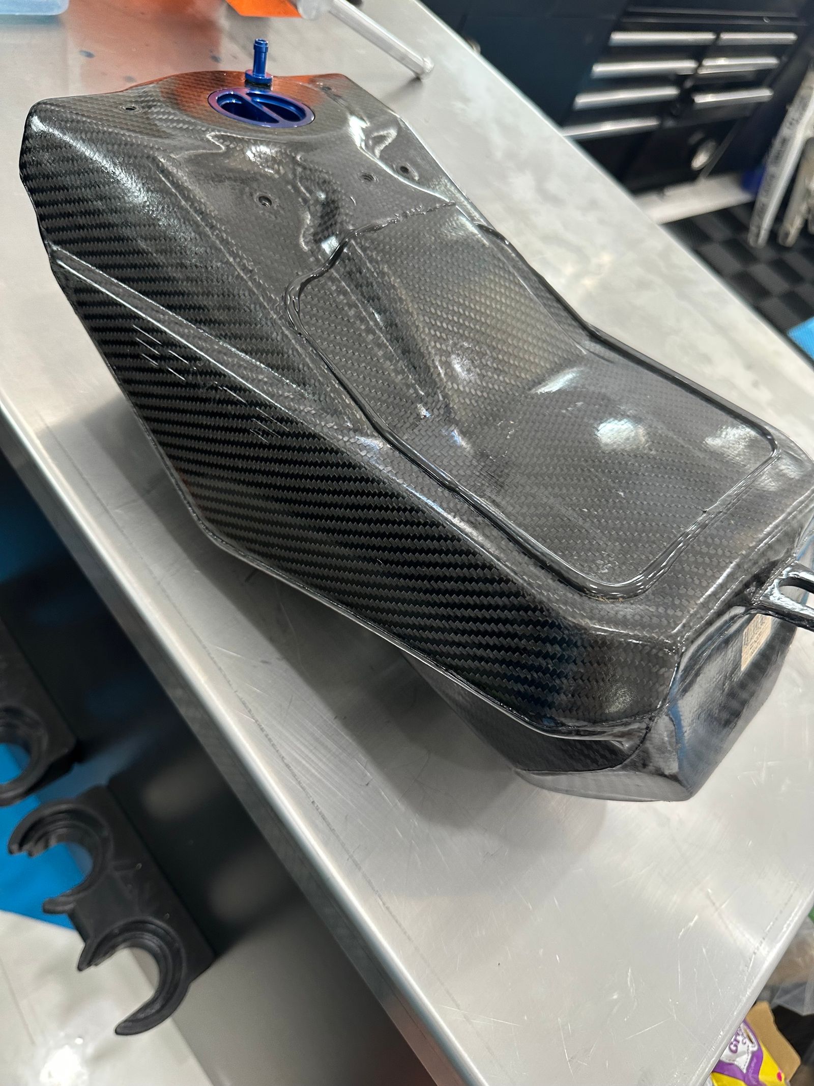 Carbon fiber gas tank outlet