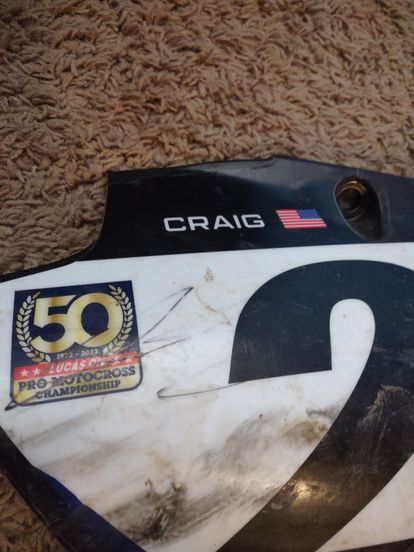 Christian Craig signed side number plate.