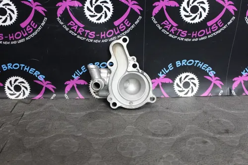 1991 KAWASAKI 88-93 KX125 OEM ENGINE WATER PUMP HOUSING COVER 16142-1084