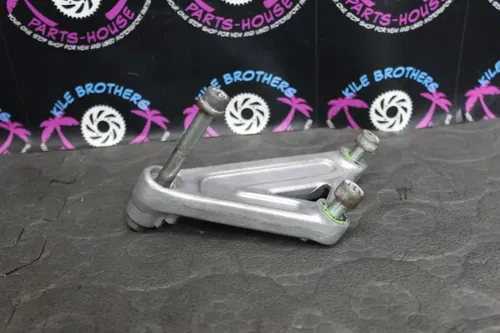 1991 KAWASAKI 90-91 KX125 OEM LEFT REAR BACK SHOCK MOUNT BRACKET 32037-1524
